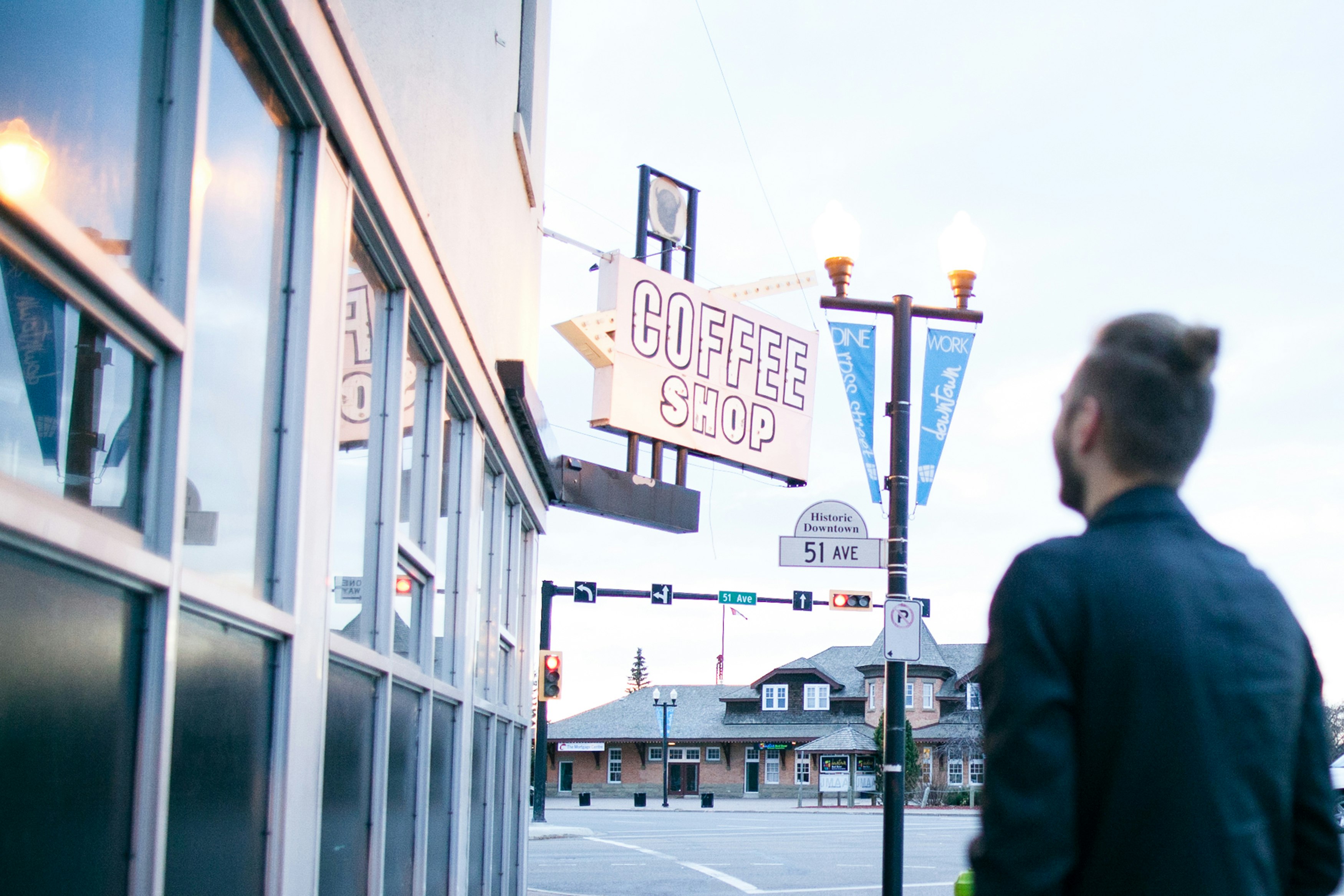 man in front of coffee shop store